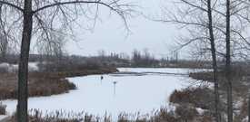One of the five pit lakes at FortWhyte Alive Nature Centre in the winter
